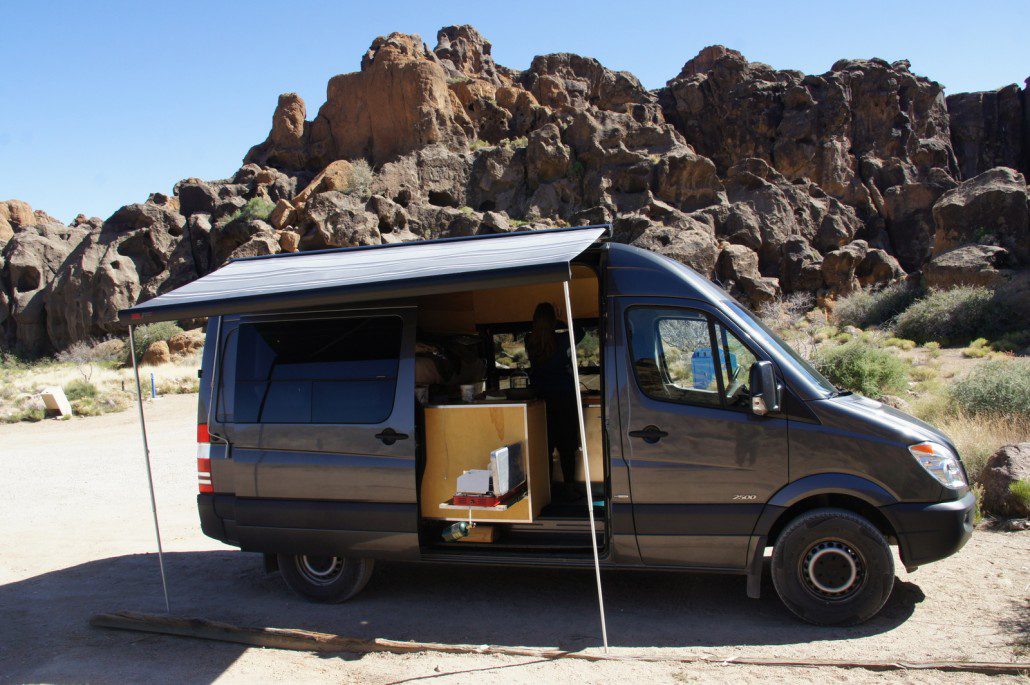 The Sprinter in action in the Mojave National Preserve. Awning and stove out while cooking a meal and enjoying the view.