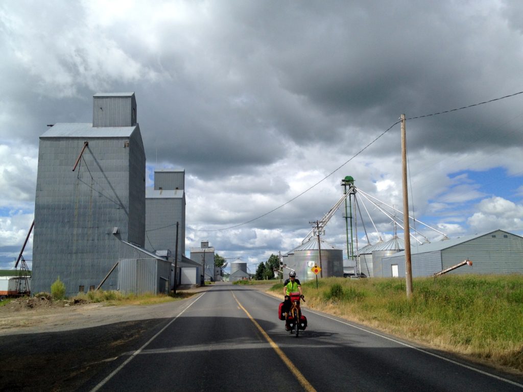 Riding between tall silos on the border of Idaho and Montana. (C photo)