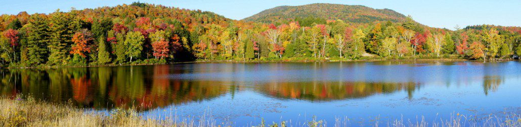 Fall colors reflected on a lake south of the town of Tupper Lake.