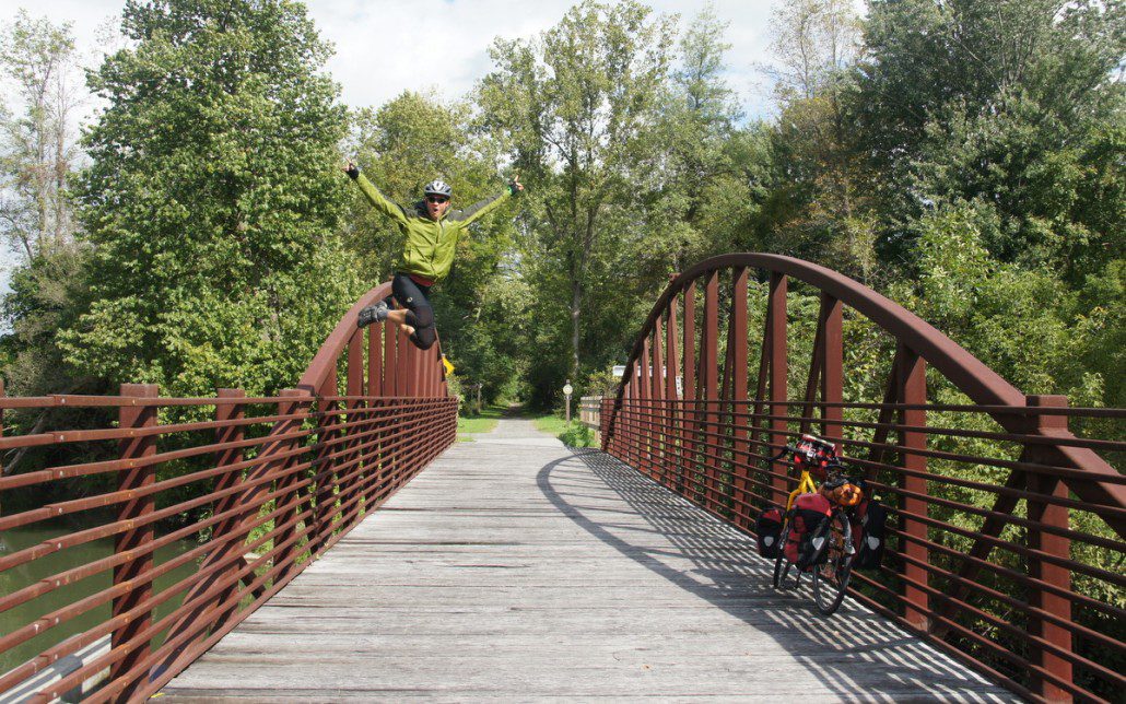 Leaping from a photo vantage point on an Erie Canal bridge.