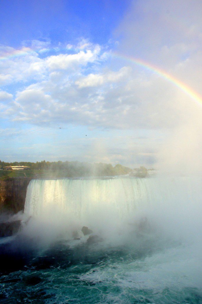 A full rainbow crests Horseshoe Falls at Niagara.