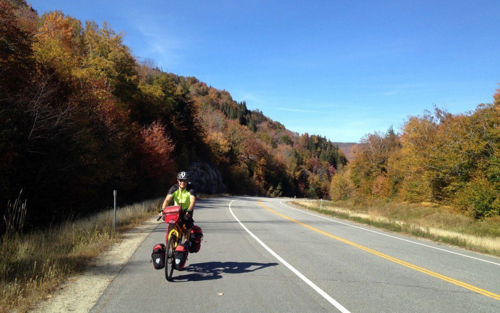 Dakota climbing in the White Mountains. Roads the way cyclists love them: low traffic and big shoulder under blue skies.
