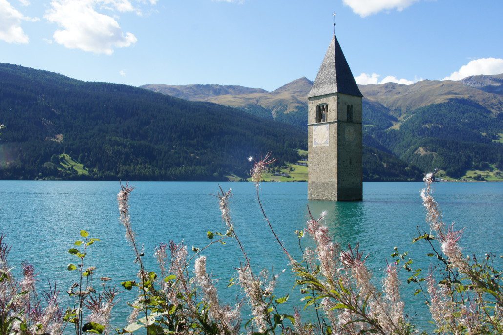 A flooded valley now sports this church spire in the middle of the lake.