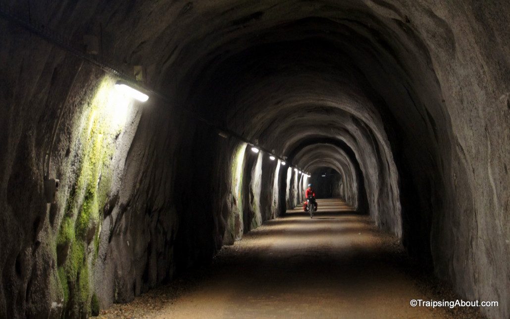 Many of the bike paths are old train lines, which means we rode through many cool tunnels like this.
