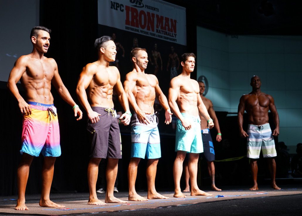 The guys compete in a swimsuit physique contest.