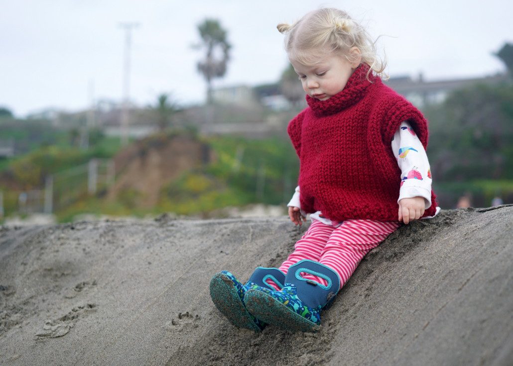 Joe and Ellee's daughter Ruby anticipates sliding down a sand dune.